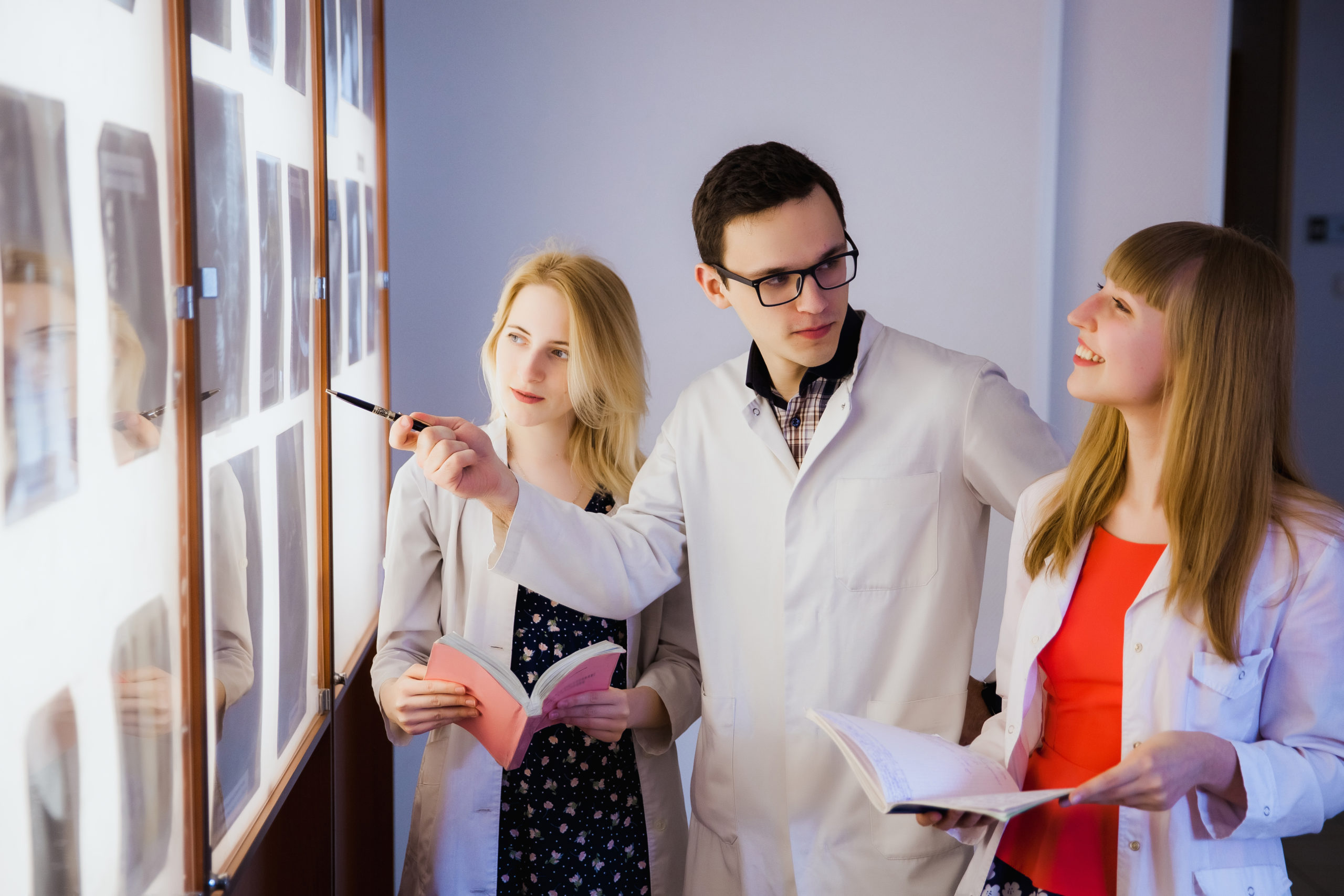group of nurse studying the sections of the brain. The concept of health education. Students in the classroom with X-rays.