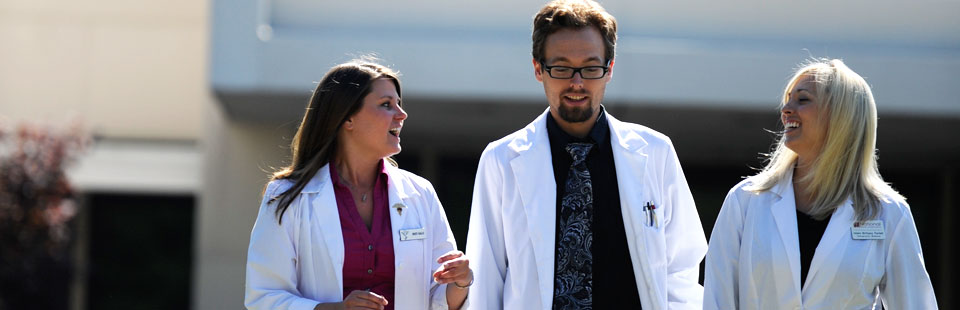 nuhs clinicians white coats outside whole health center lombard