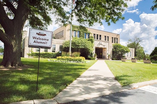 NUHS campus with Welcome Alumni sign