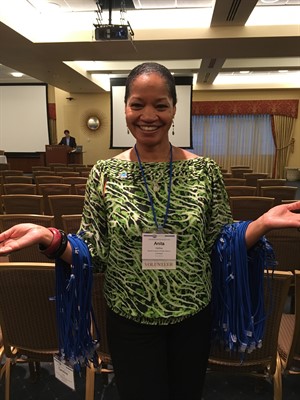 Anita Hollins collecting name badges