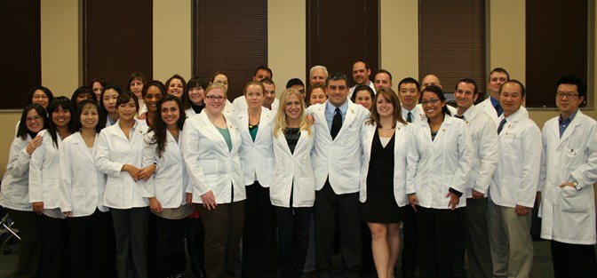 acupuncture oriental medicine student white coat pin ceremony