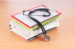 books stacked stethoscope