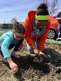 NUHS student with young child working in botanical garden