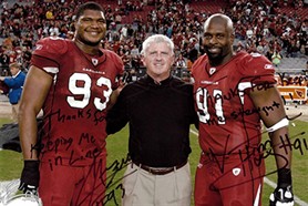 doctor curtis maynard on field with arizona cardinals