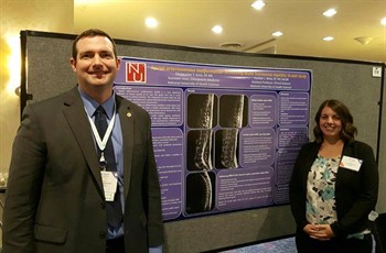 NUHS faculty stand next to their poster at DC2017