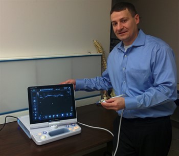 Brandon German, DC, NUHS Diagnostic Imaging Senior Resident with new ultrasound equipment
