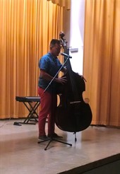 student playing bass talent show