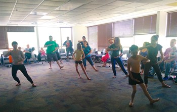 local families participating in dance class
