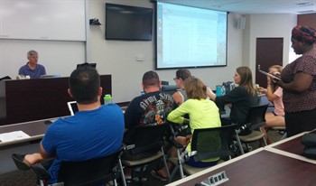 Dr. Timothy Fior, MD, DHt speaking to students