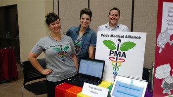 students behind booth at club lunch day