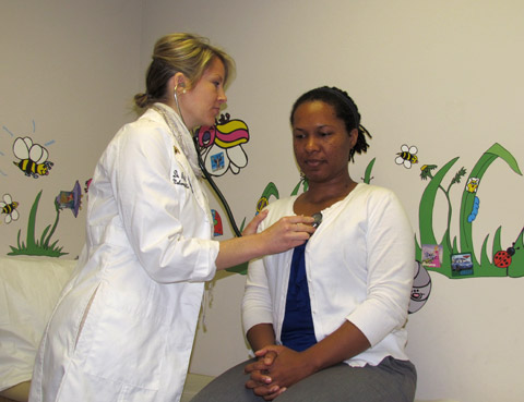 Rachel Marynowski, ND, working with patient