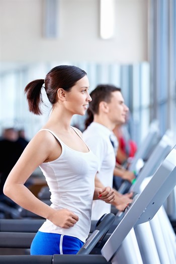woman running on treadmill