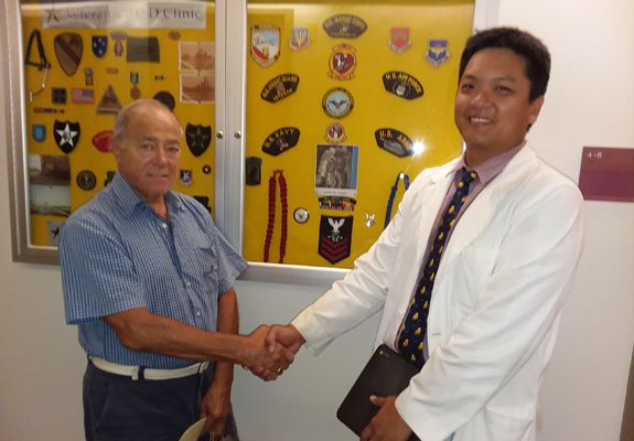NUHS clinic doctor with veteran patient