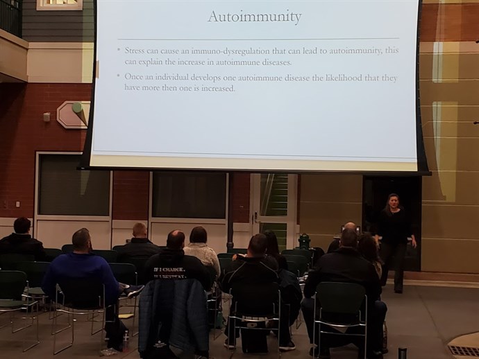 Dr Jurik teaching in front of room