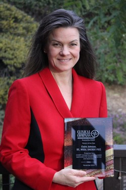 Claire Johnson holding Clinical Compass Person of the year award
