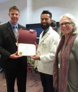 Michael Abenoja with NUHS faculty