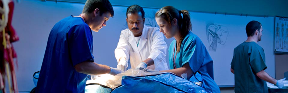 students and faculty in hands on lab
