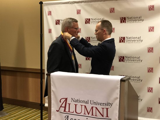 Mike Whitmer, vice president of NCMIC Chiropractic Insurance Programs, receiving the President's Quality Service Award