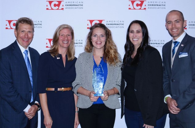 Dr. Ray Tuck, Jr., ACA president and 1997 NUHS graduate; Dr. Michele Maiers, ACA Board of Governors; Jenny Razey, National University-Illinois, recipient of the 2018 J. Michael Flynn Award; Dr. Heidi Henson, Chair of ACA's SACA Advisory Committee and Dr. Bryan Kent, SACA immediate past chair.