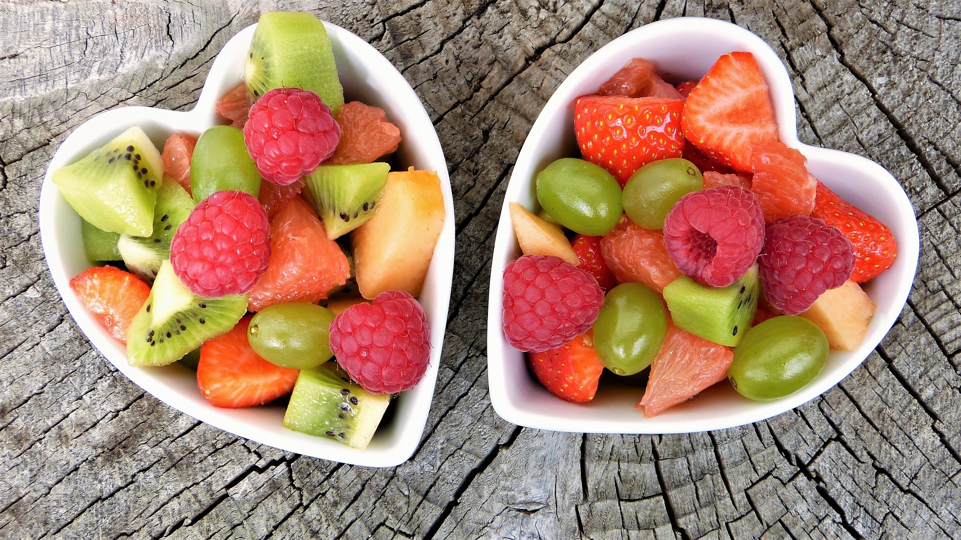 healthy, fresh fruit in heart-shaped bowls