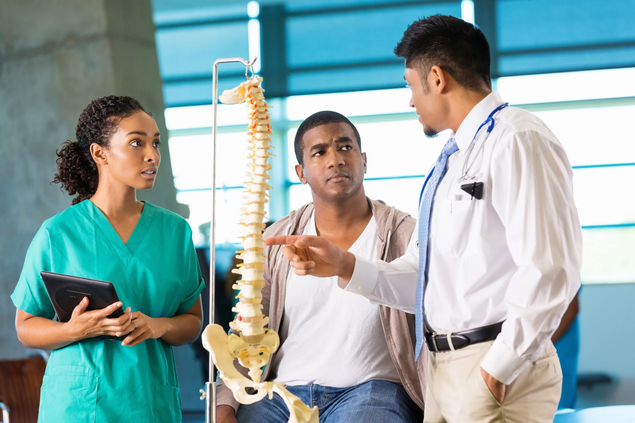 chiropractic students talking to instructor