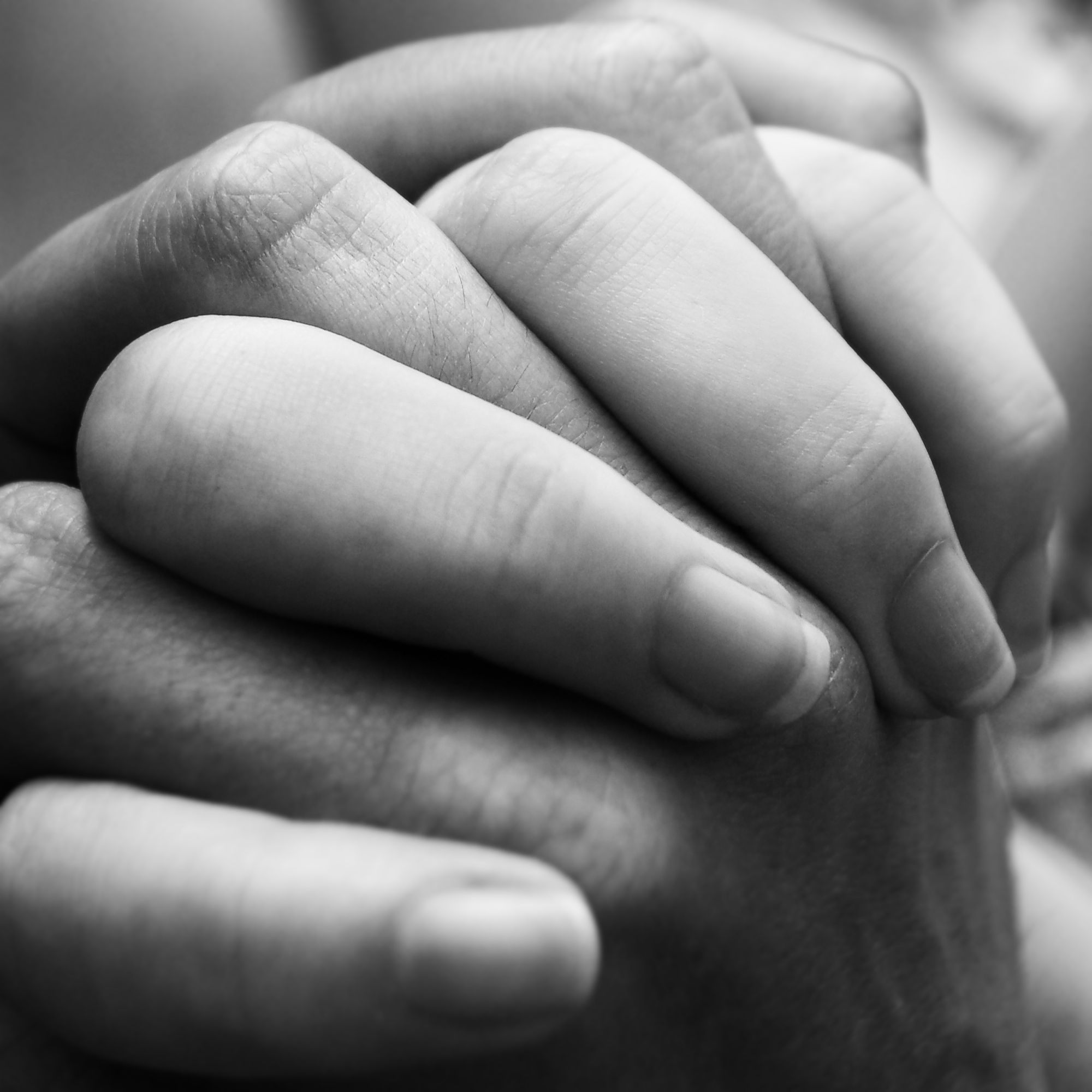 Two hands clasped together