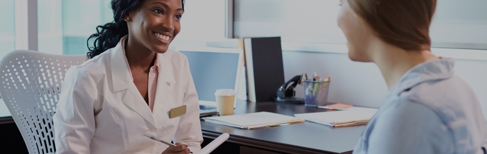 complementary & alternative medicine student speaking to patient