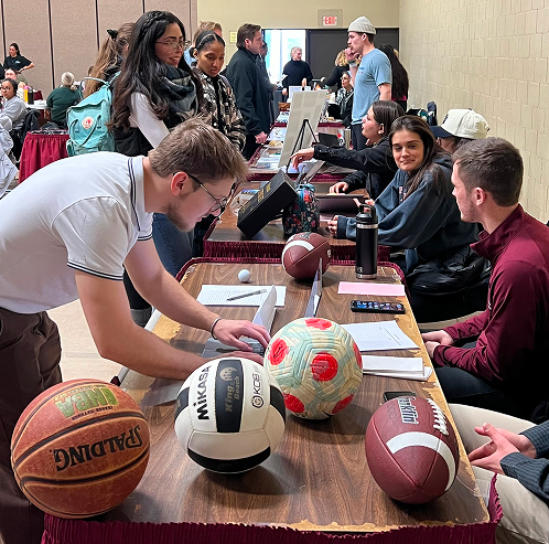 students signing up for sports club