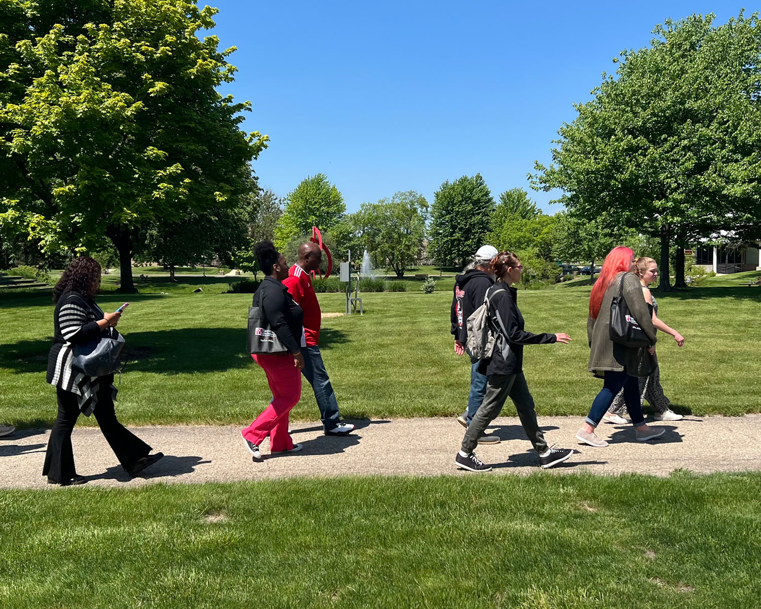 students walking by lake