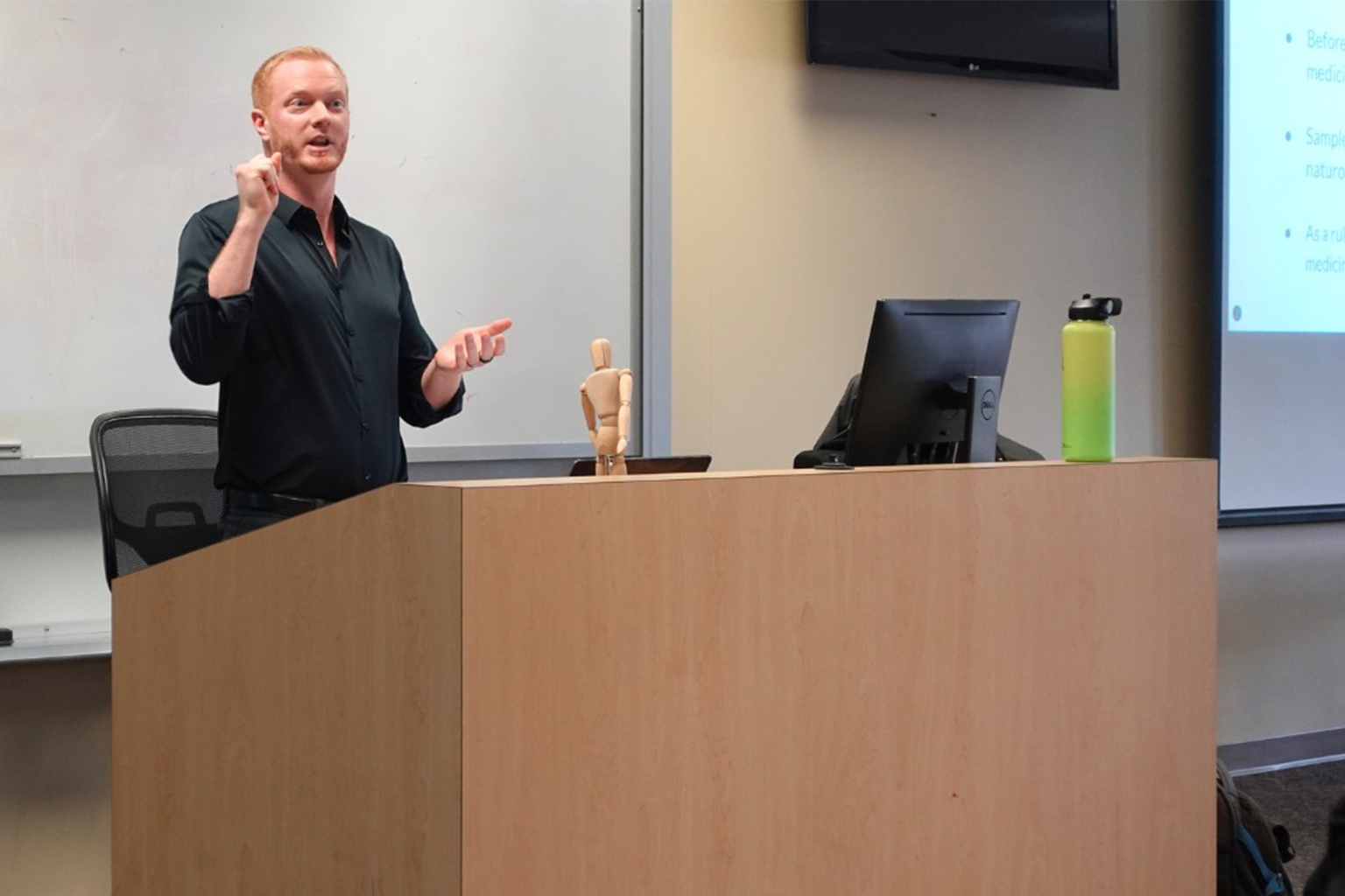 Dr. Robinson presenting in front of classroom