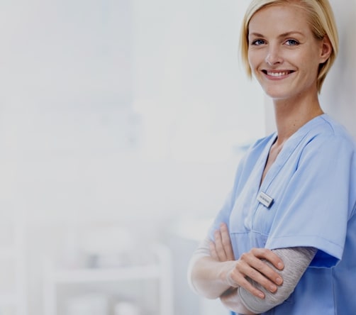 Photo of female chiropractor in scrubs