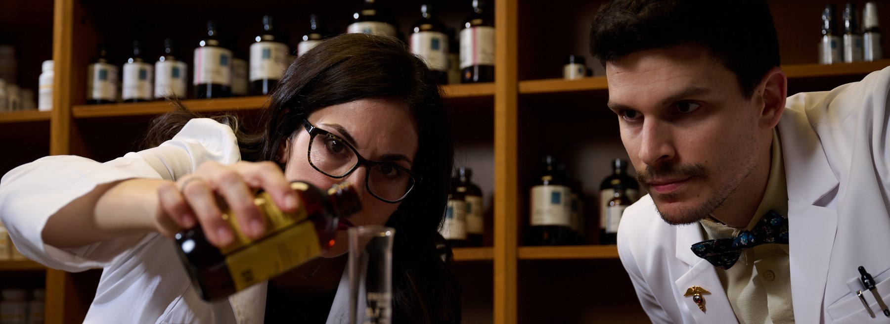 Two students mixing naturopathic medicine in the dispensary