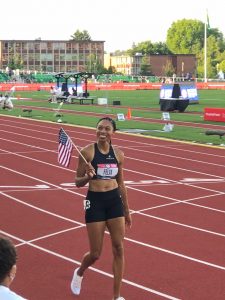 olympic trials athlete holding american flag