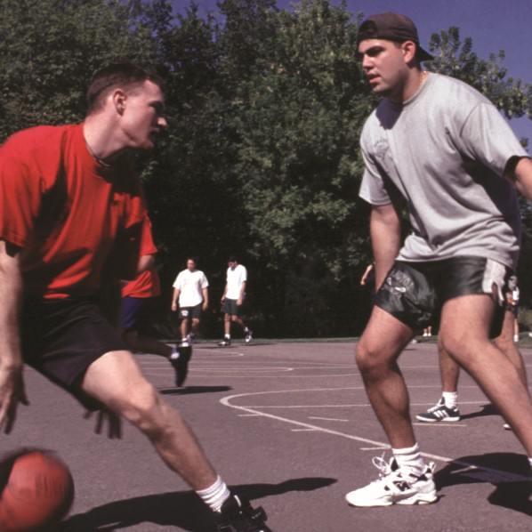 two young athletes playing basketball