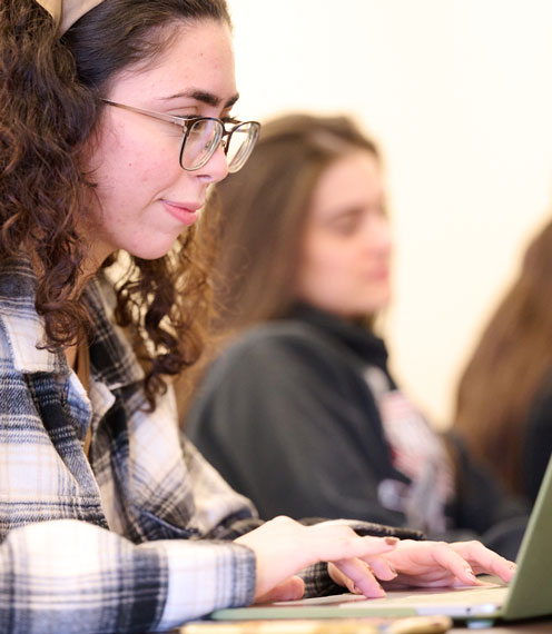 female student on her laptop