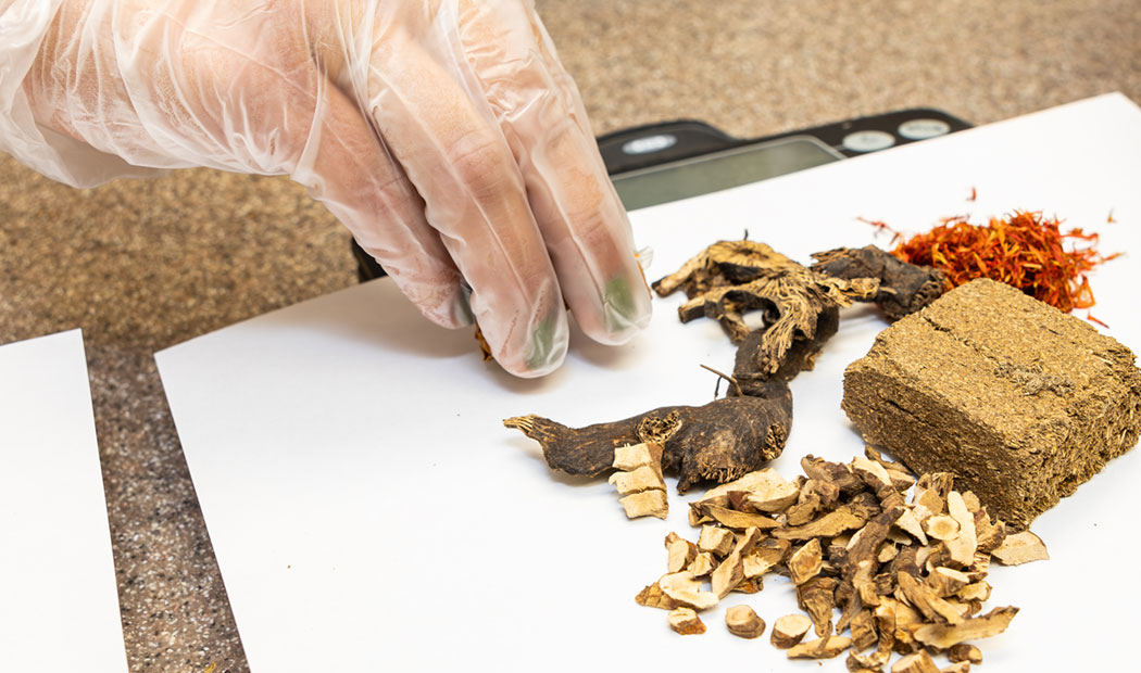 naturopathic doctors preparing herbal medicine