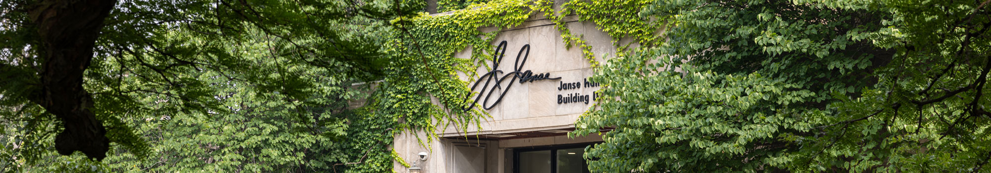 shot of Janse hall surrounded by tree and ivy