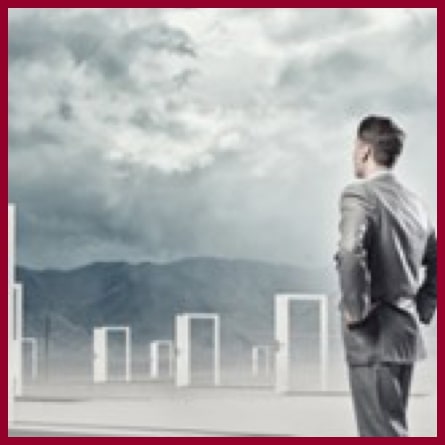 man looking at mountains with fake doors