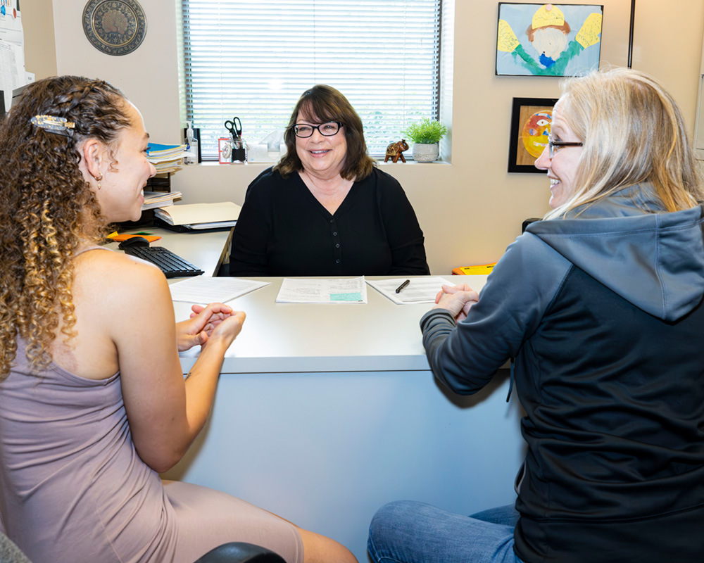 students working with an NUHS faculty member