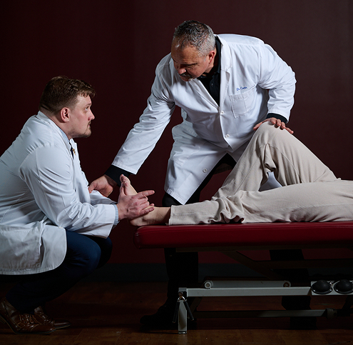 instructor guiding DC student in adjustment