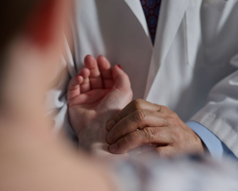 doctor performing acupressure on patient