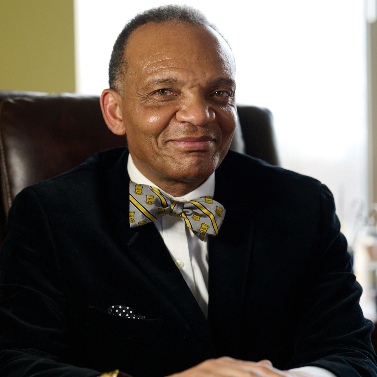 Dr. Johnson sitting at his desk