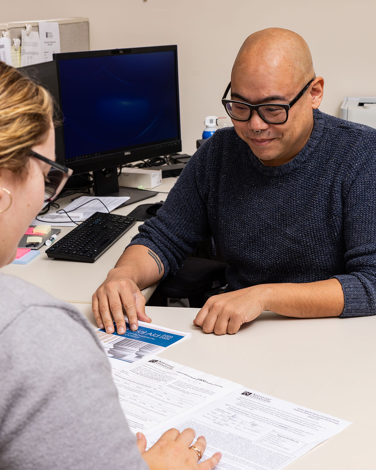 financial aid staff helping student