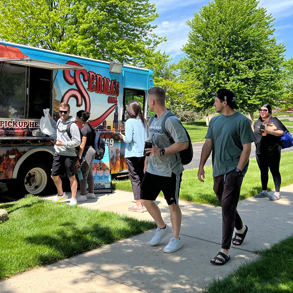 students getting food from food truck