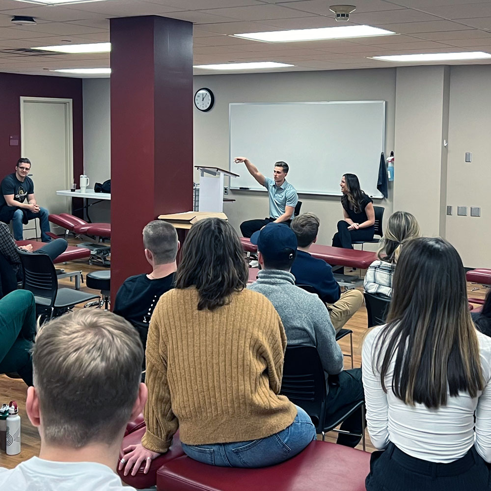 students listening to guest speaker