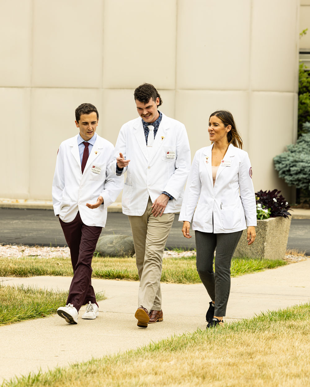 healthcare students walking outside of the clinic