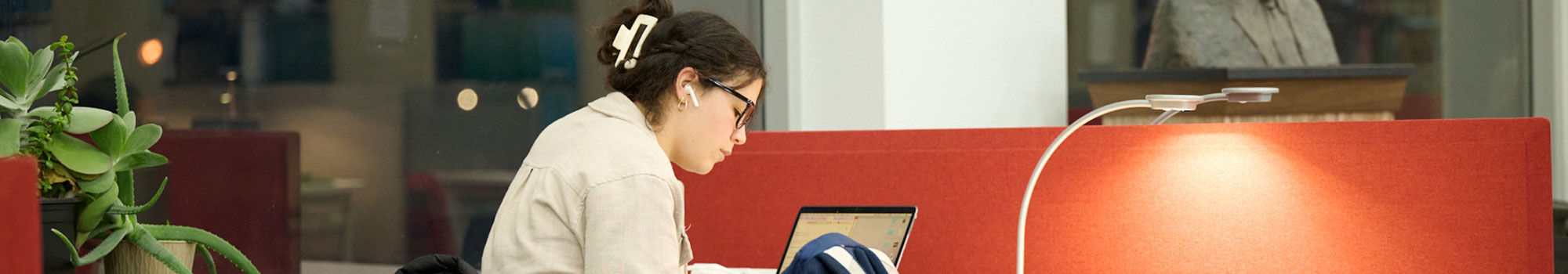 student studying in library