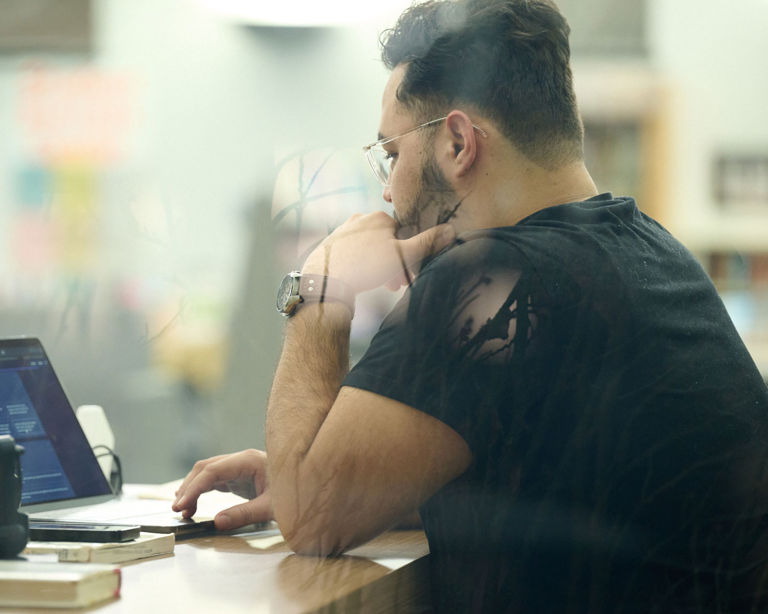 student looking through the library catalog