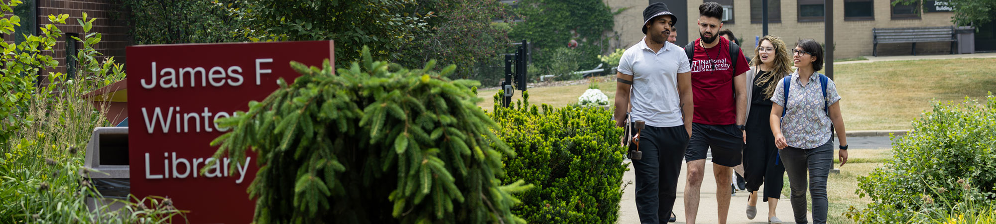 students walking into library