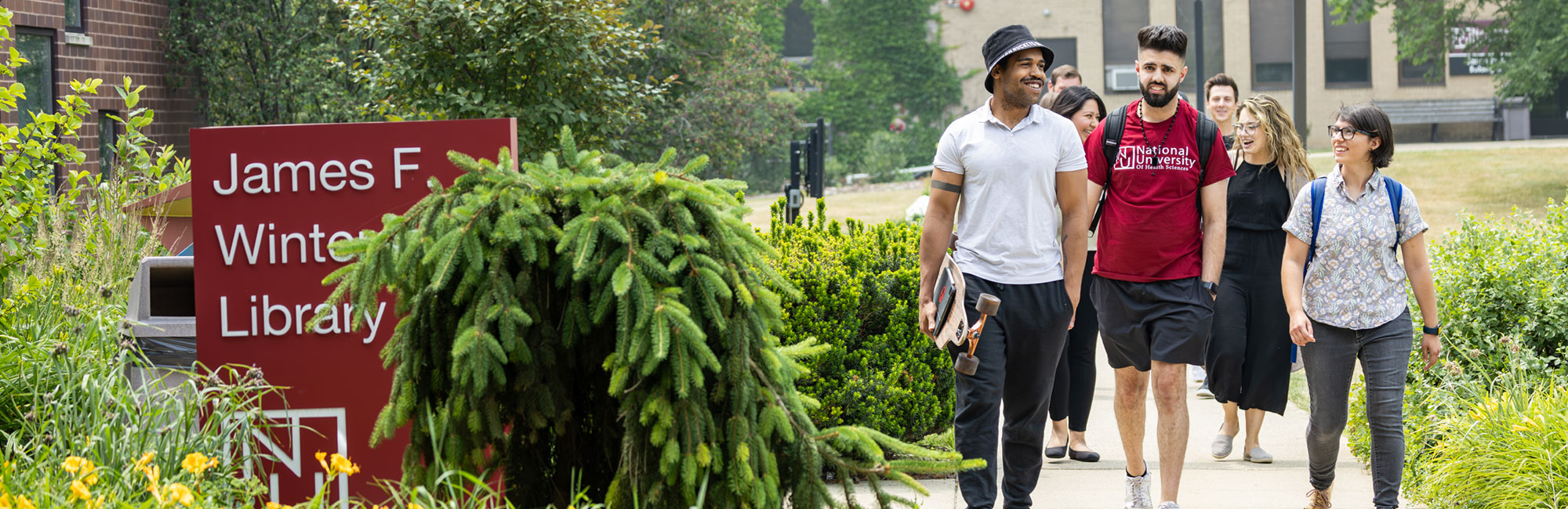 students walking into the library